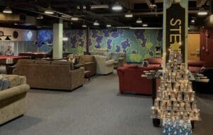 Student lounge with pool table and couches.