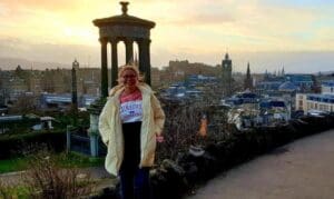 Woman in Edinburgh, Scotland at sunset.