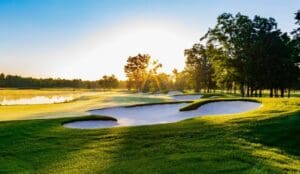 Sunrise over a scenic golf course.